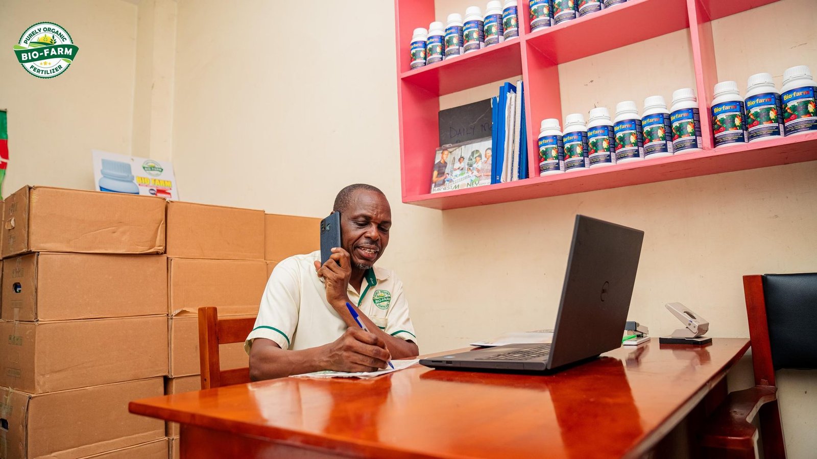 A Bio-Farm agent taking a customer order at his desk