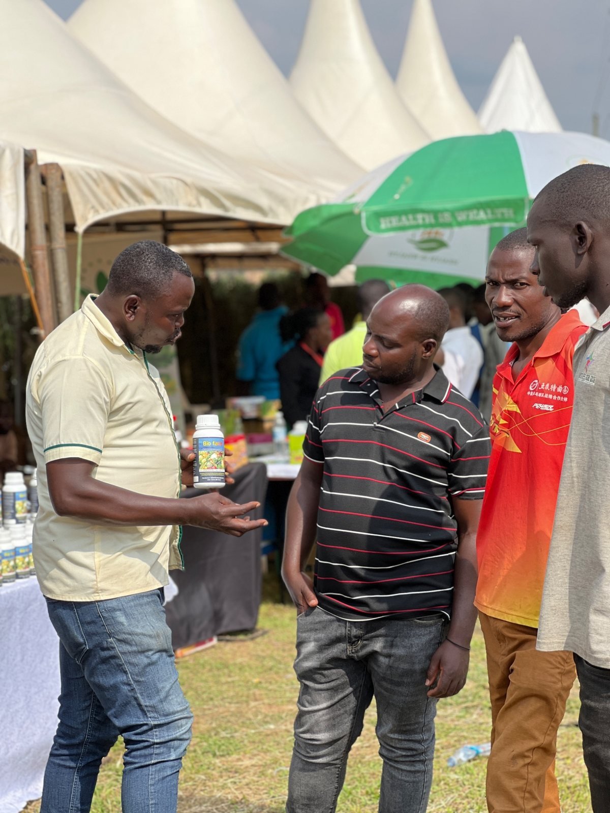 Farmers examining treated crops during a training visit